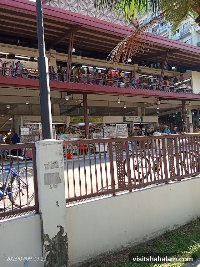 Market stalls with clothing and groceries