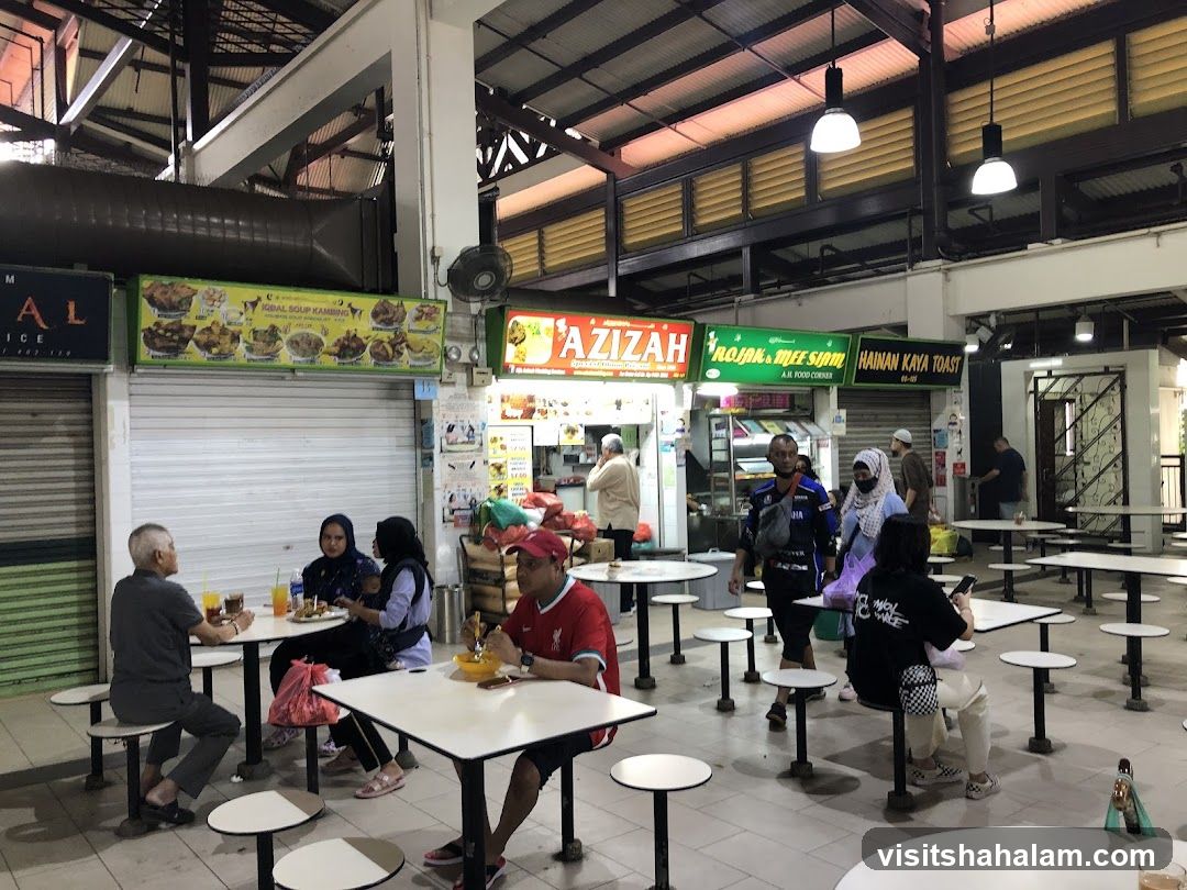 Food court with various stalls and diners