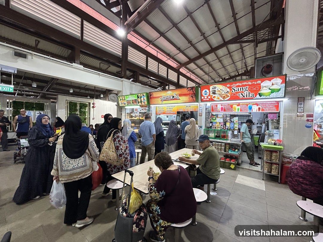 Food court with various stalls and diners