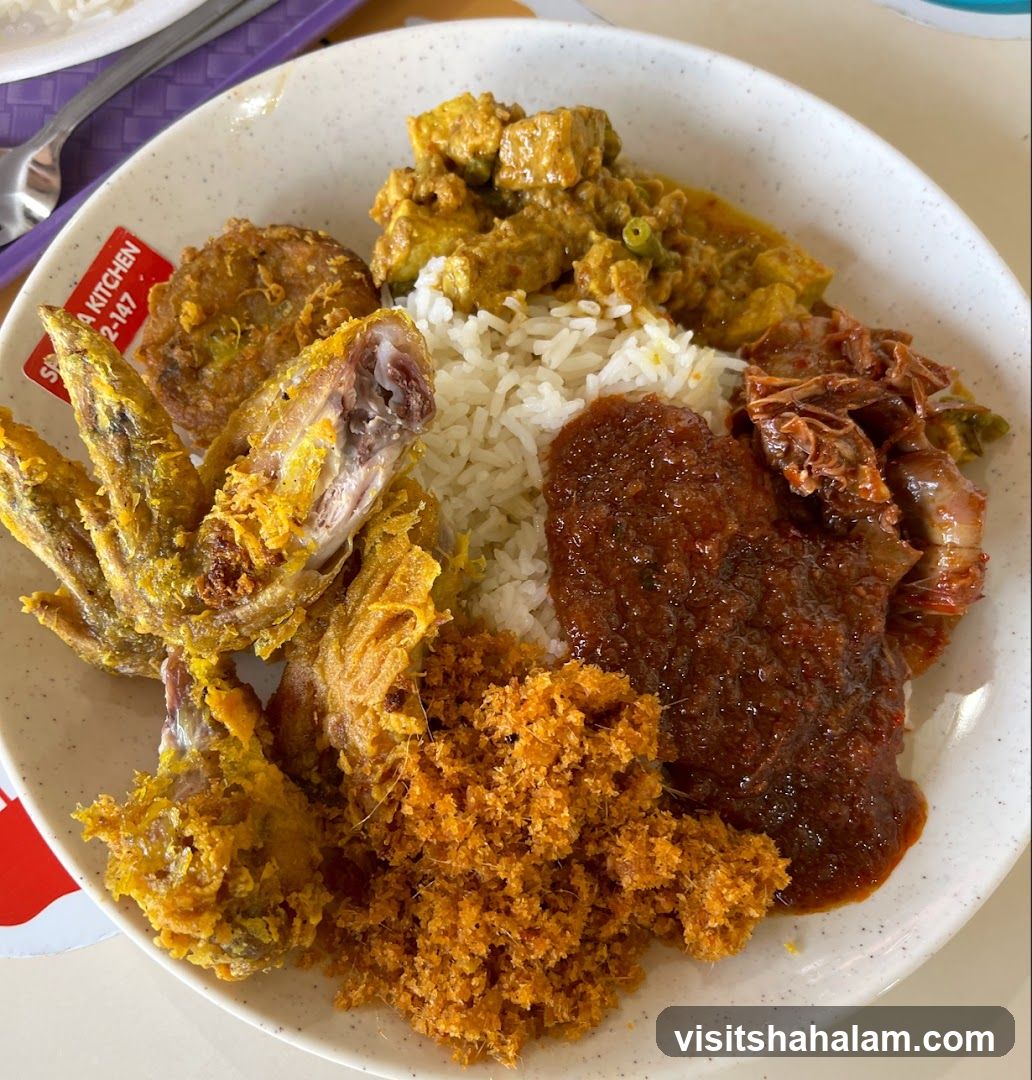 Plate of food with fried chicken wings and rice
