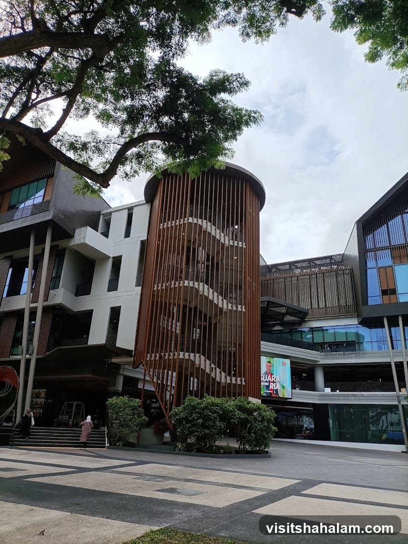 Modern Building with Outdoor Staircase and Digital Billboard