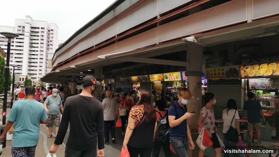 Busy Food Stalls Under a Covered Walkway