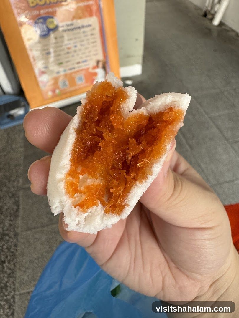 Close-up of a sweet bun with orange filling