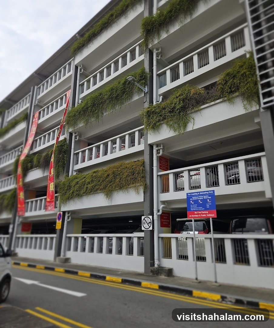 Multi-level parking garage with greenery and signage