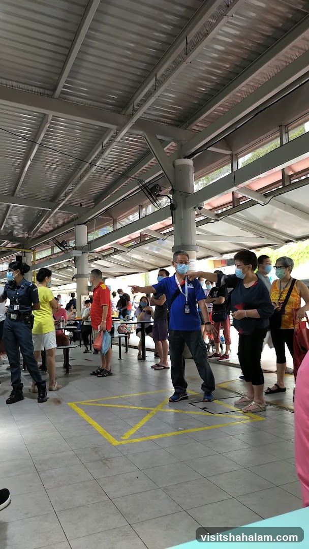 People queuing at an outdoor food court