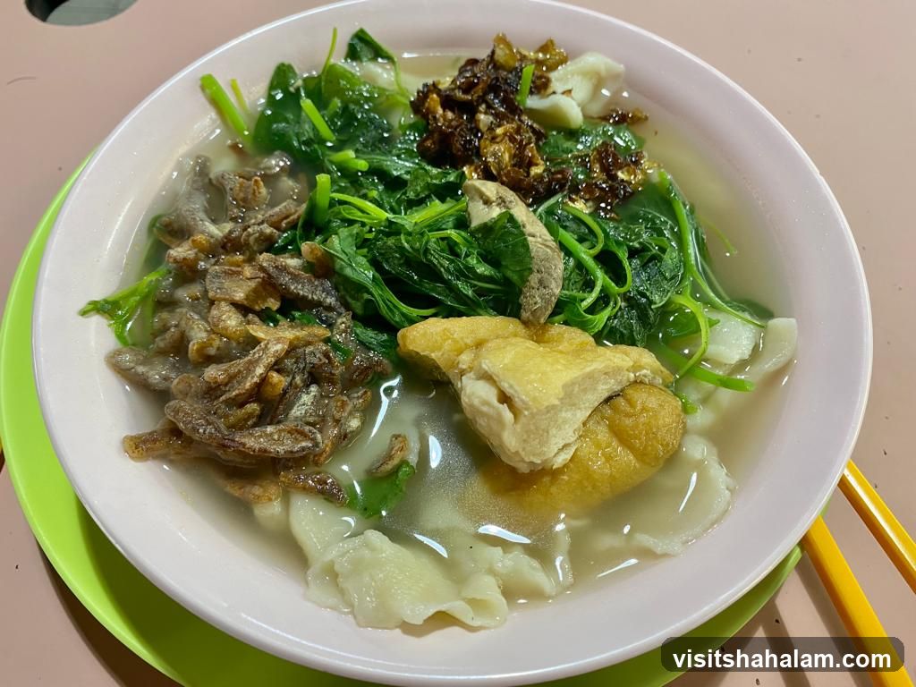 Bowl of Noodles with Vegetables and Fried Anchovies