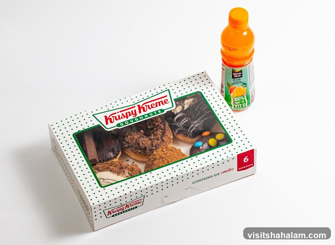 Krispy Kreme Doughnuts Box and Orange Drink