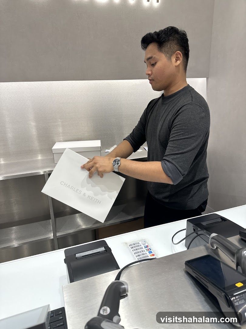 Employee holding a shopping bag
