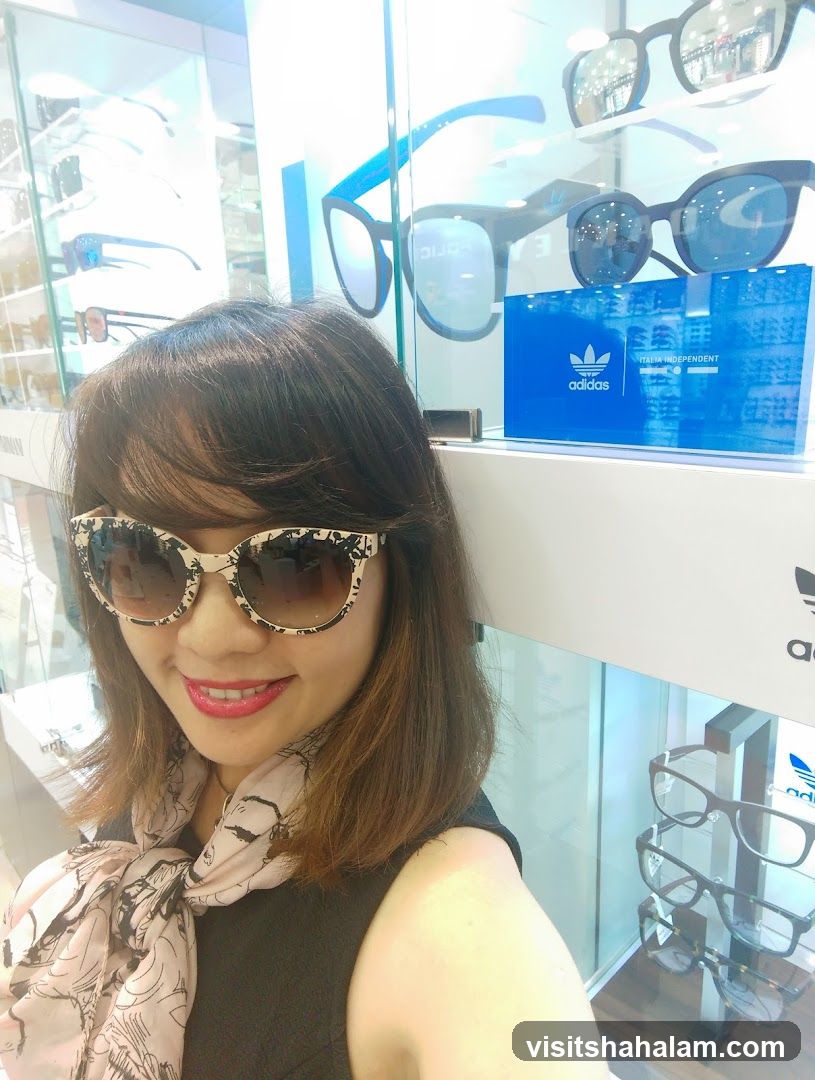 Woman trying on sunglasses