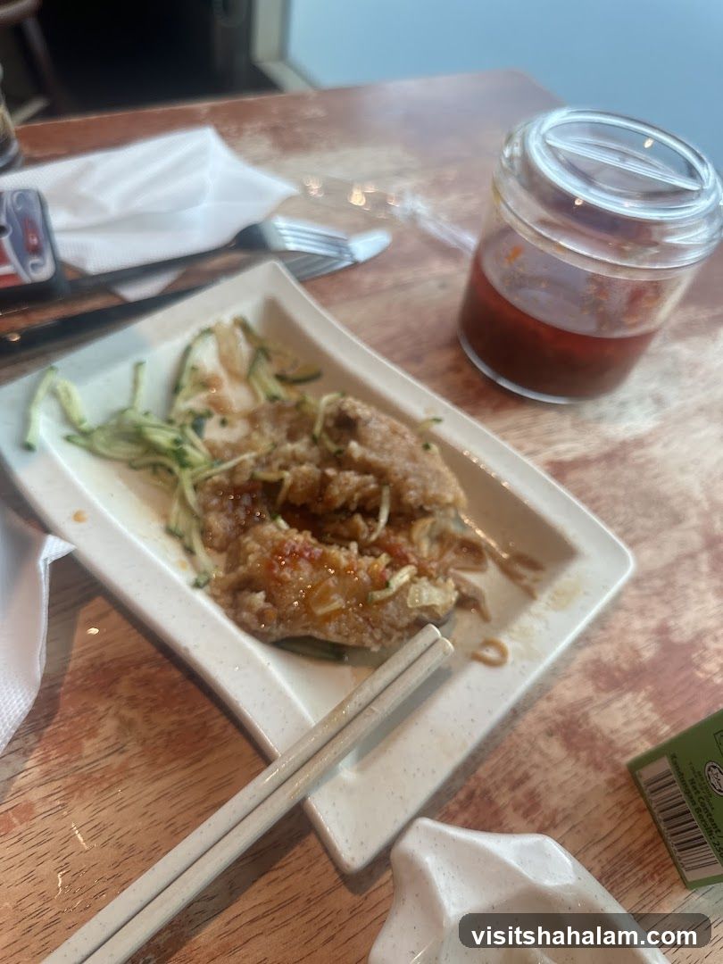 Fried Food with Sauce and Chopsticks