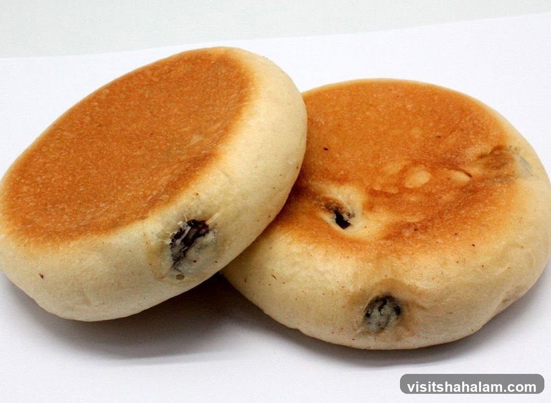Two sweet buns with raisins
