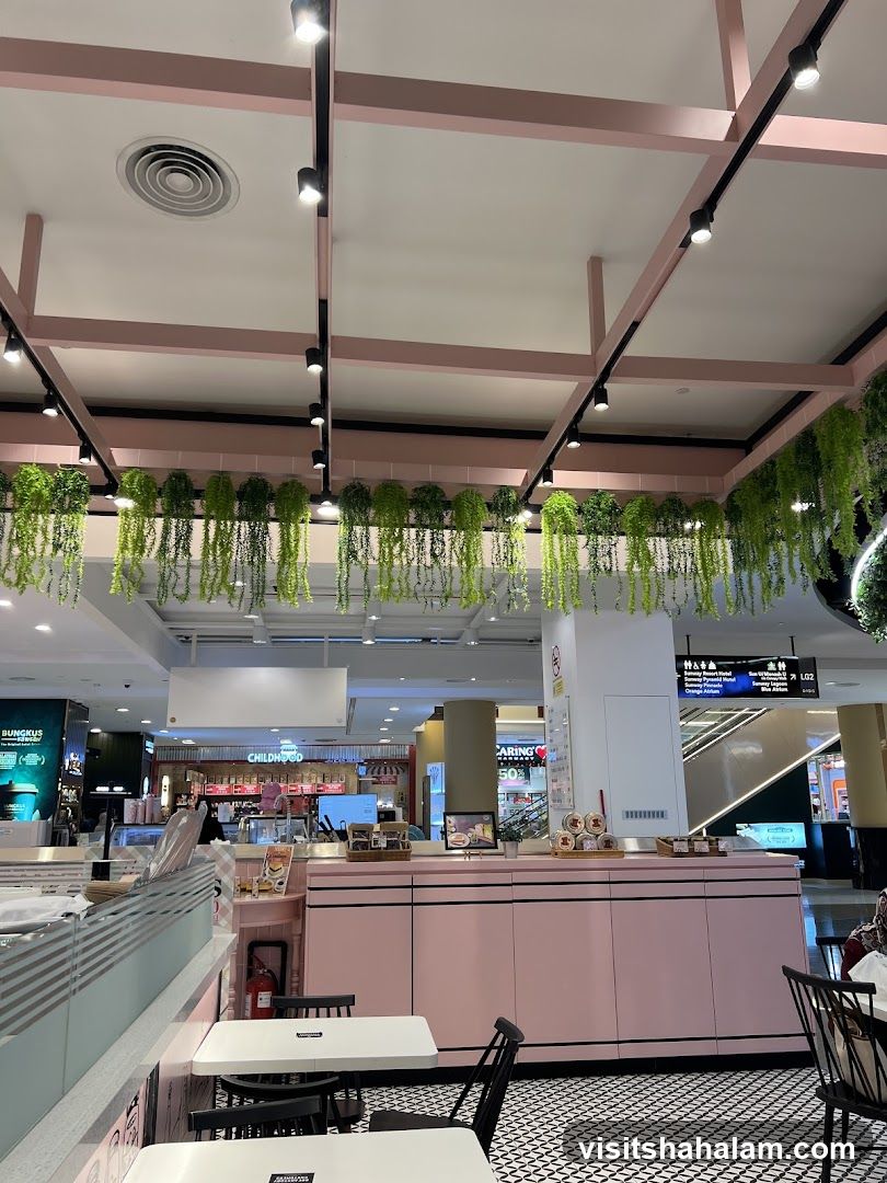 Cafe Interior with Pink Accents and Hanging Plants