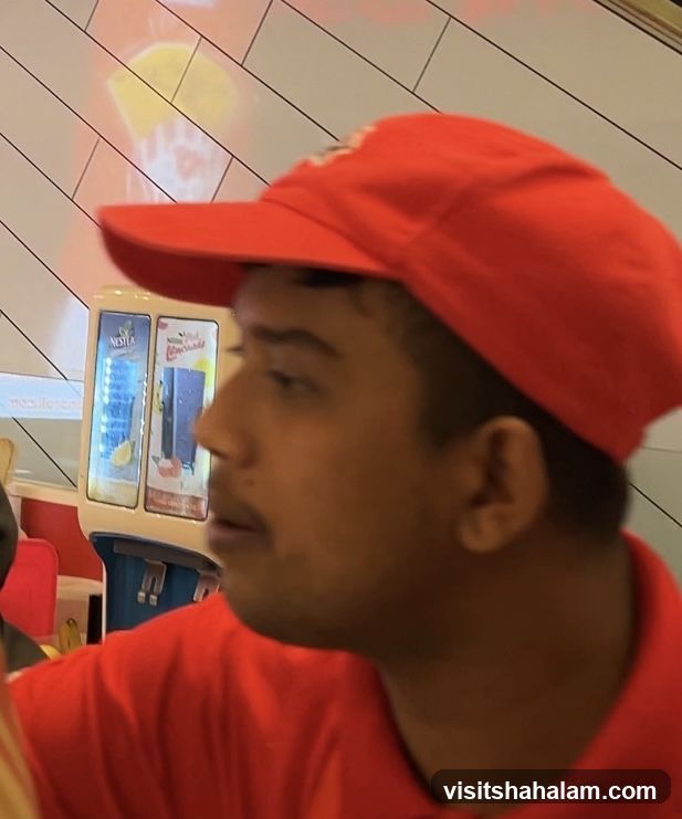 Employee at a Beverage Station