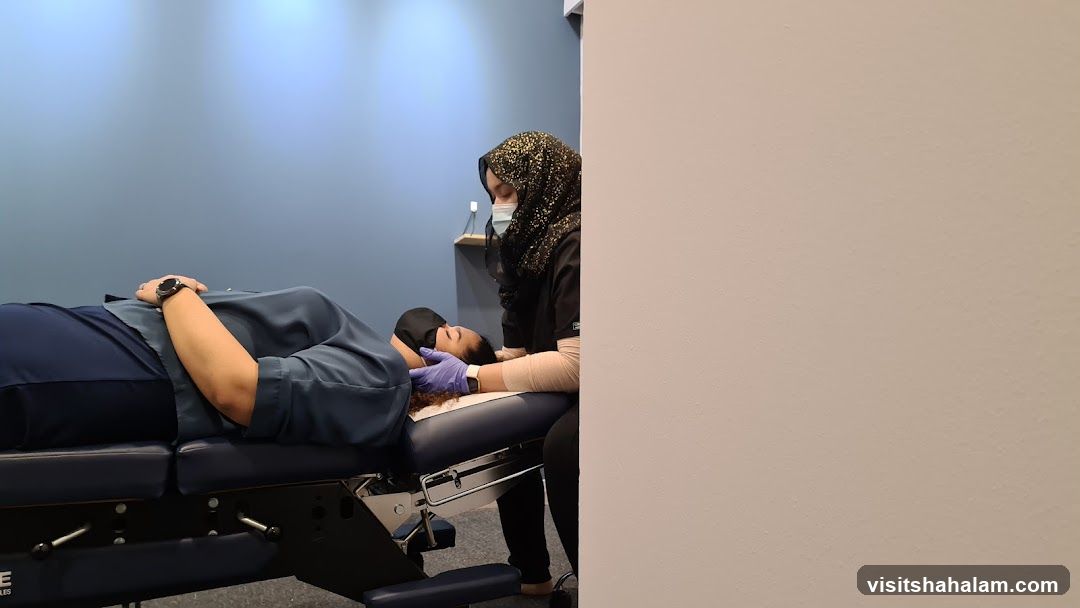 Chiropractor Adjusting Patient