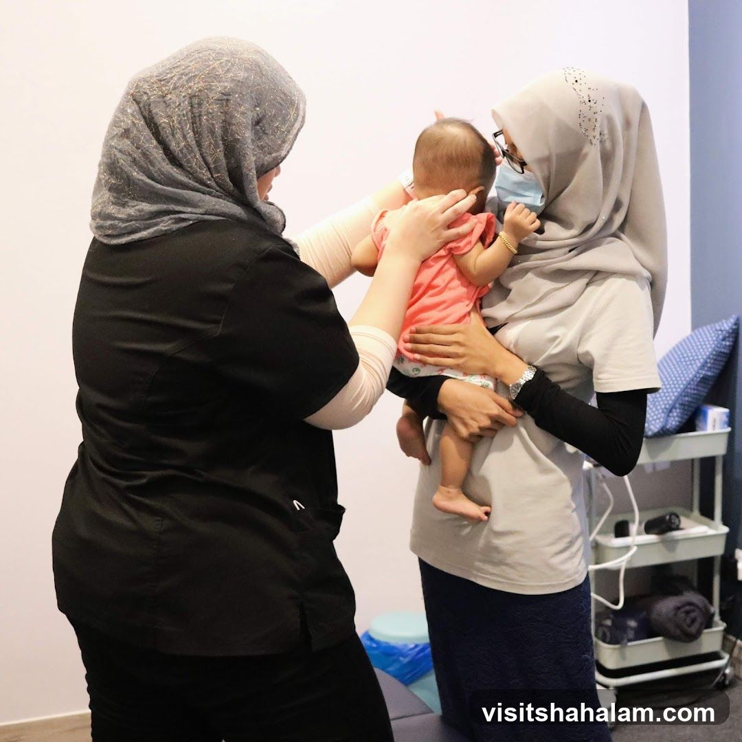 Therapist examining a baby