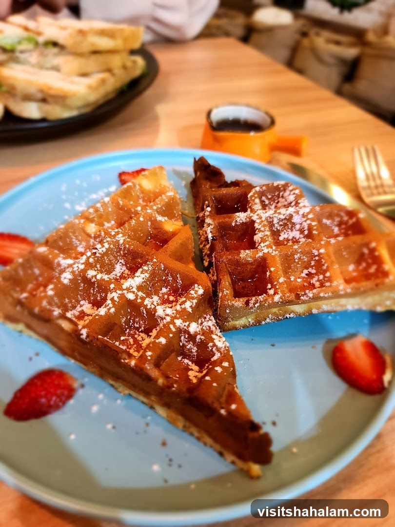 Waffles with Strawberries and Syrup