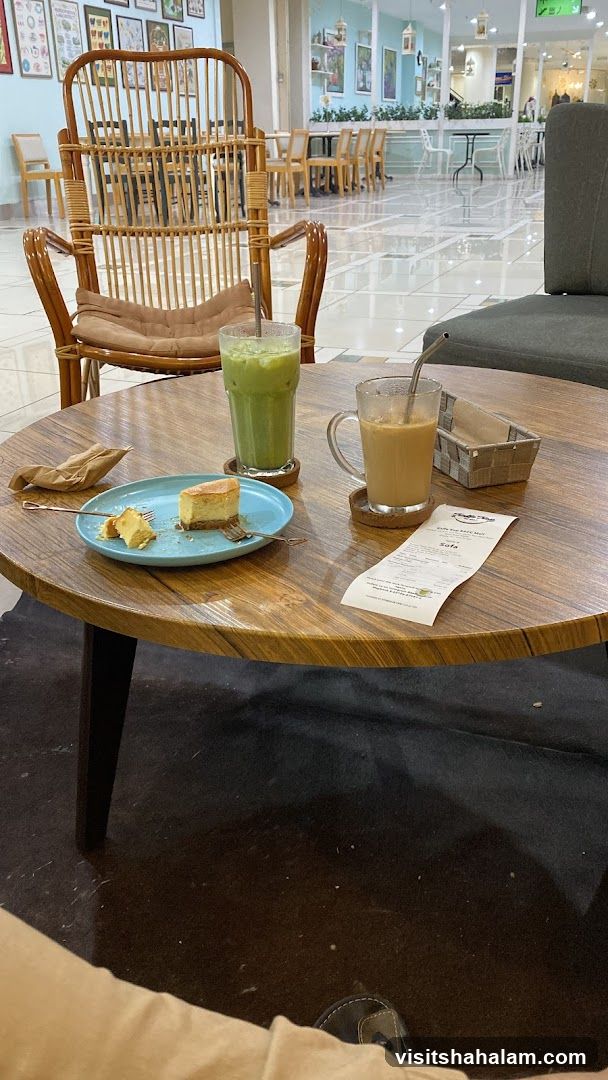 Cafe Table with Drinks and Cake