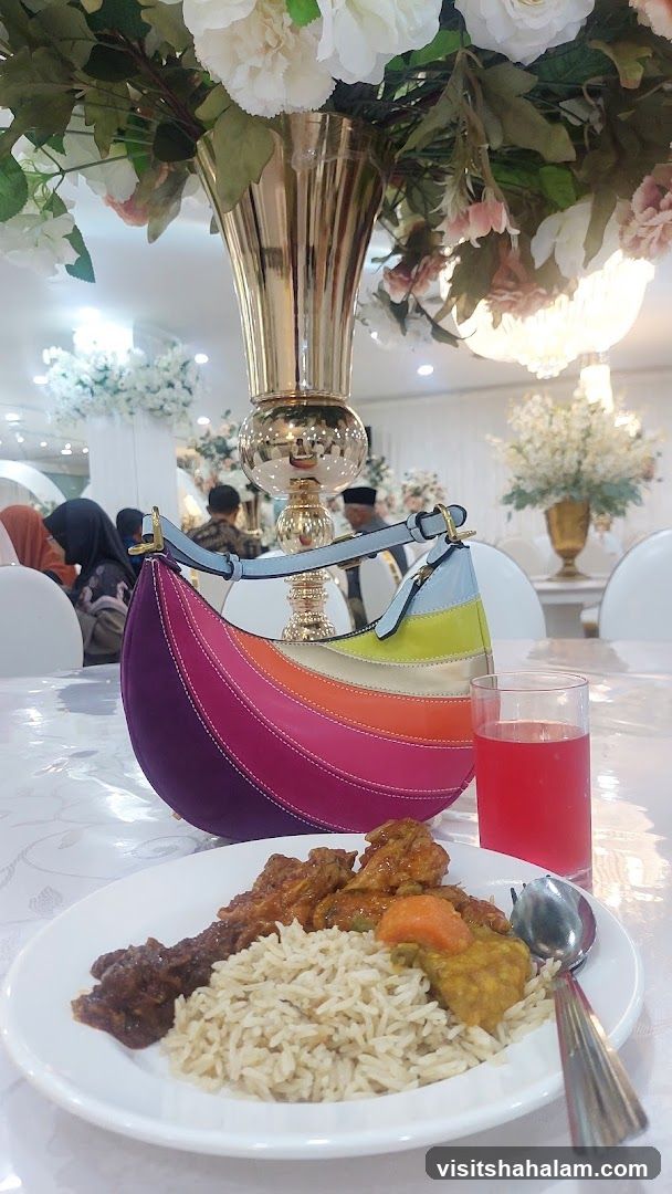 A plate of food with a colorful handbag and a drink