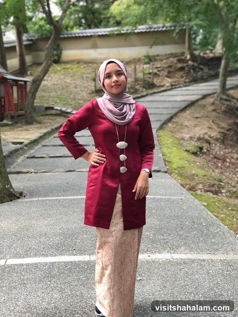 Woman in Traditional Attire Posing Outdoors