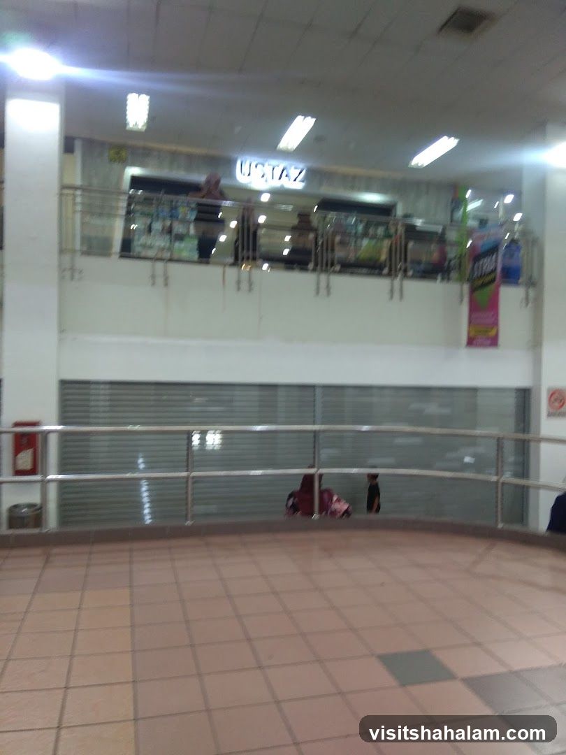 Indoor mall walkway with shops