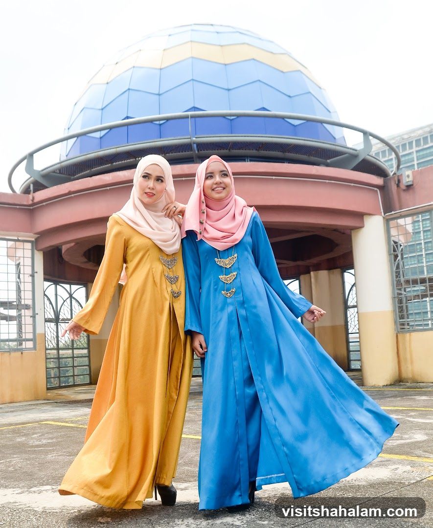 Two Women Posing in Traditional Attire