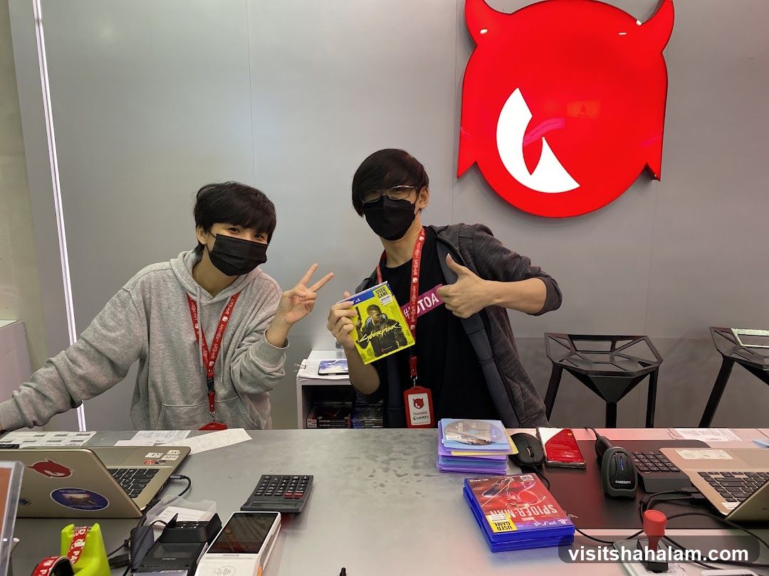 Two people behind a counter