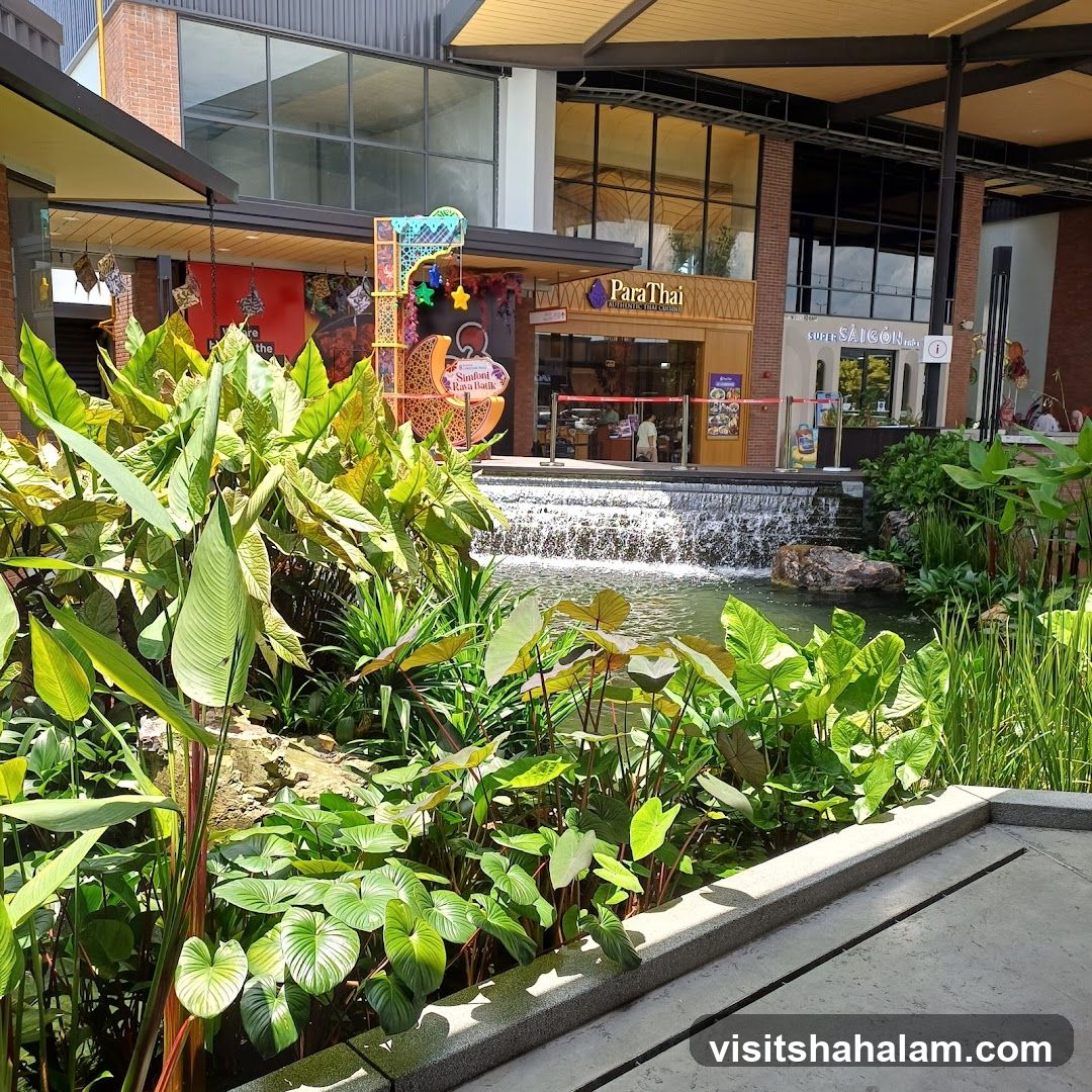 Outdoor mall with water feature and shops