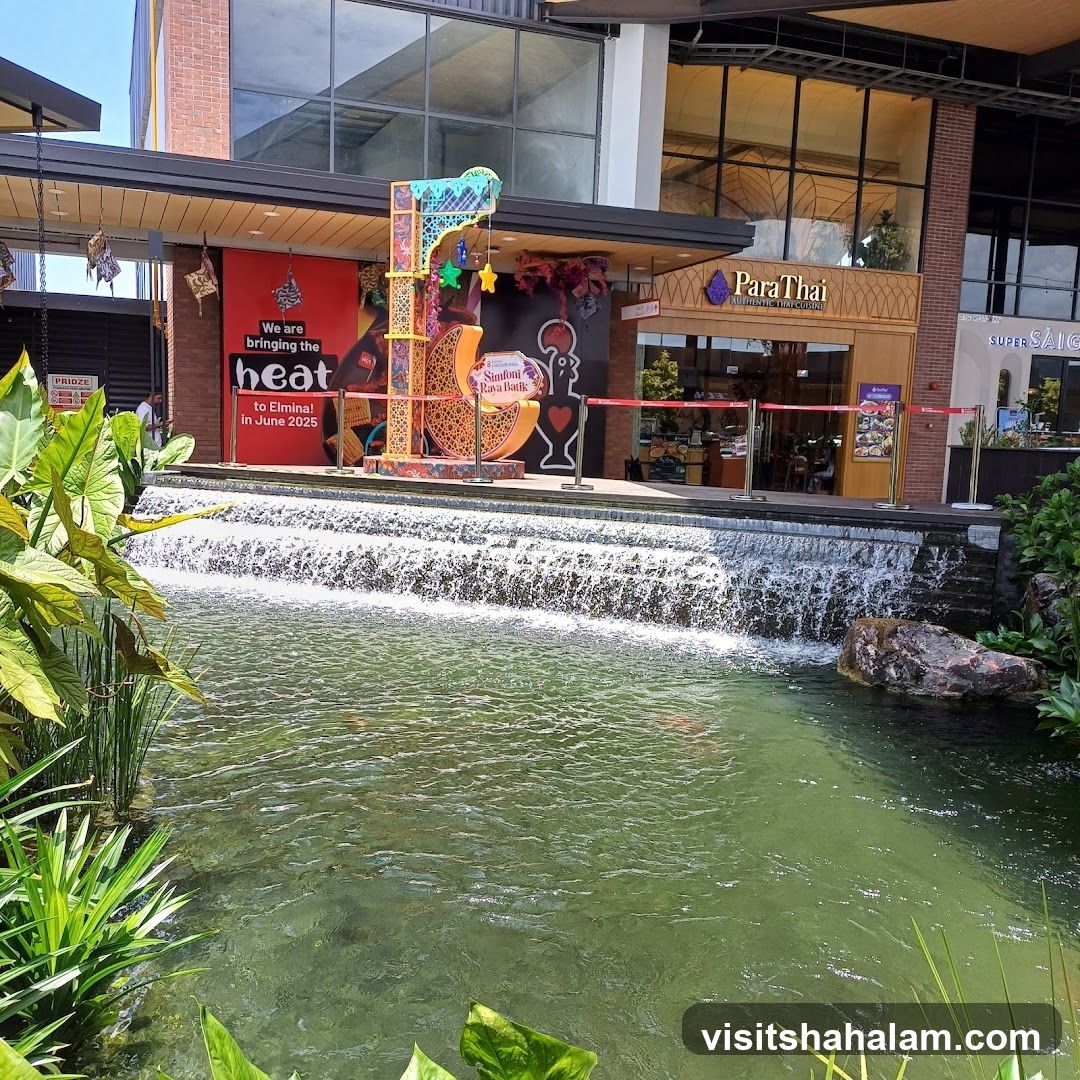 Outdoor mall with a water feature and shops