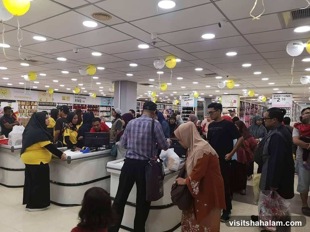 Busy store with shoppers at checkout