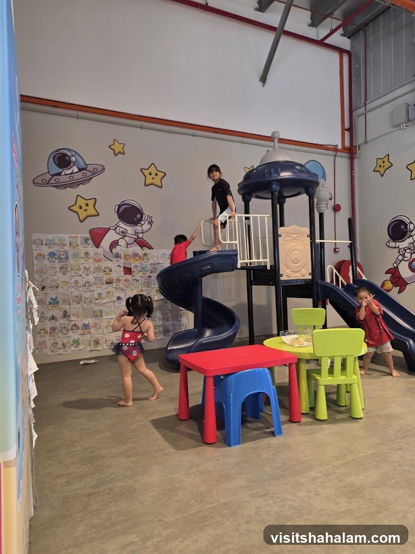 Children Playing in a Space-Themed Indoor Playground