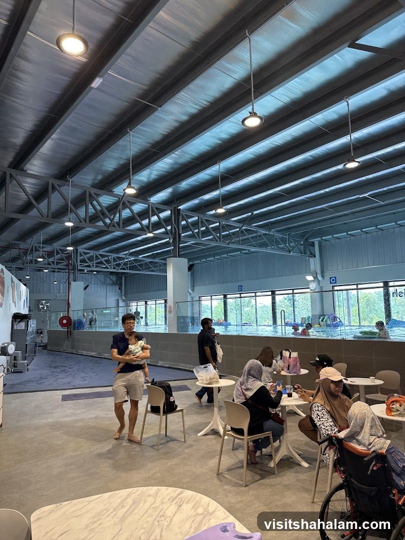 Indoor swimming pool area with seating