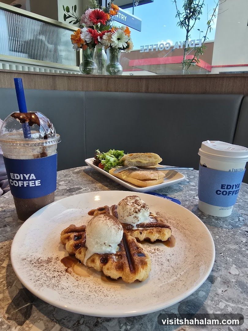 Coffee shop table with waffles and drinks