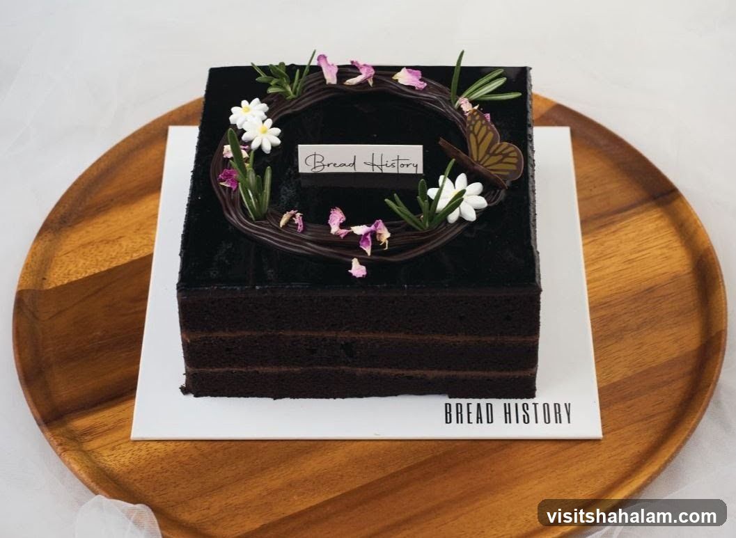Chocolate Cake with Floral and Butterfly Decoration
