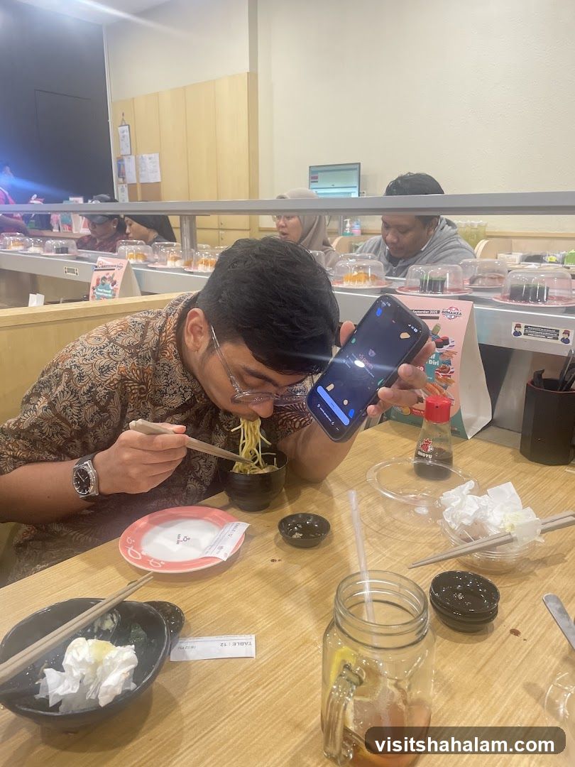 Diners at a Conveyor Belt Sushi Restaurant