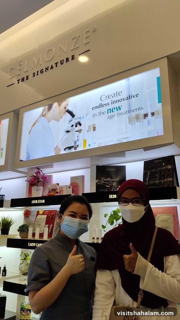 Two women giving thumbs up in a store