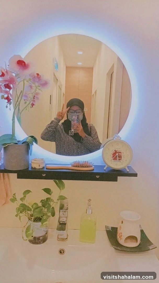 Woman taking a mirror selfie in a bathroom