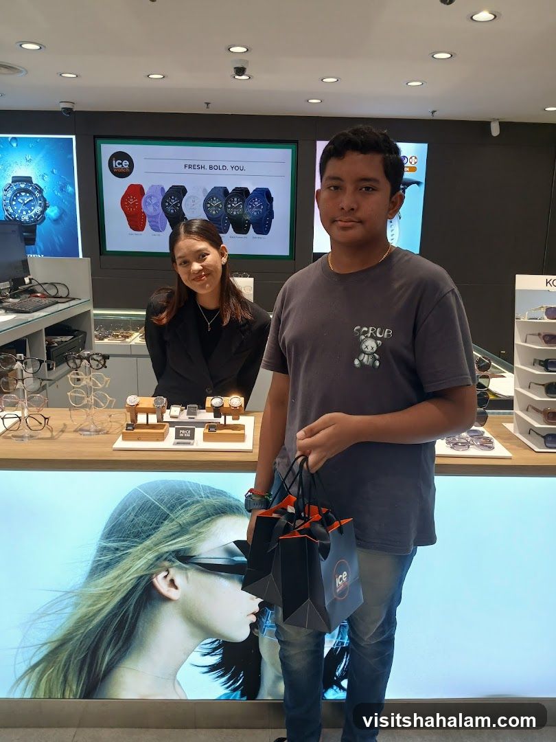 Young man holding shopping bags in a watch store