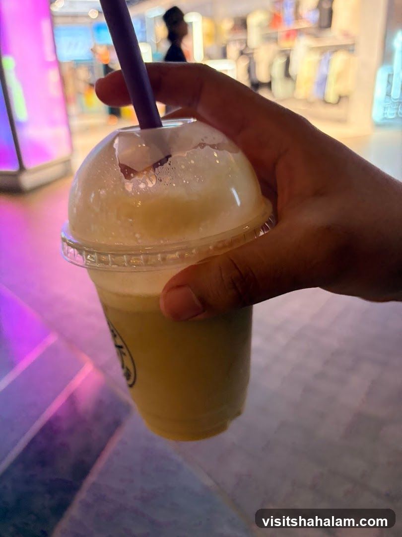 Hand holding a beverage