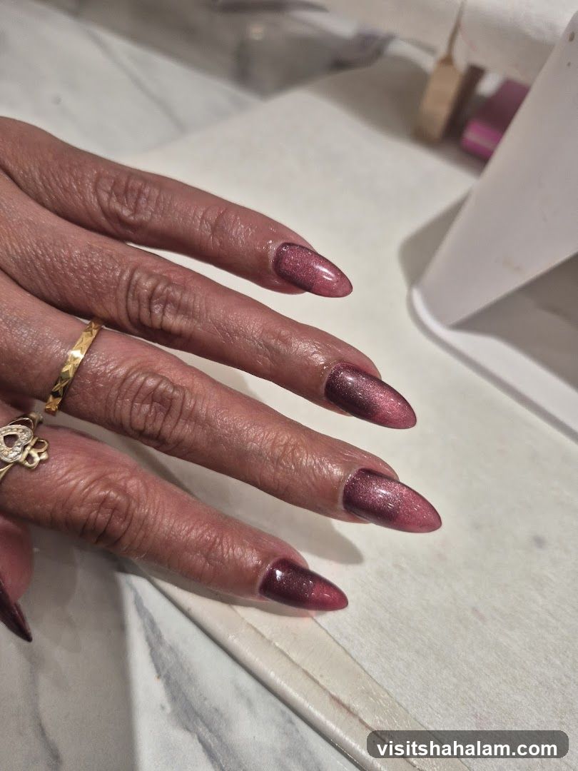 Woman's Hands with Cat Eye Nails