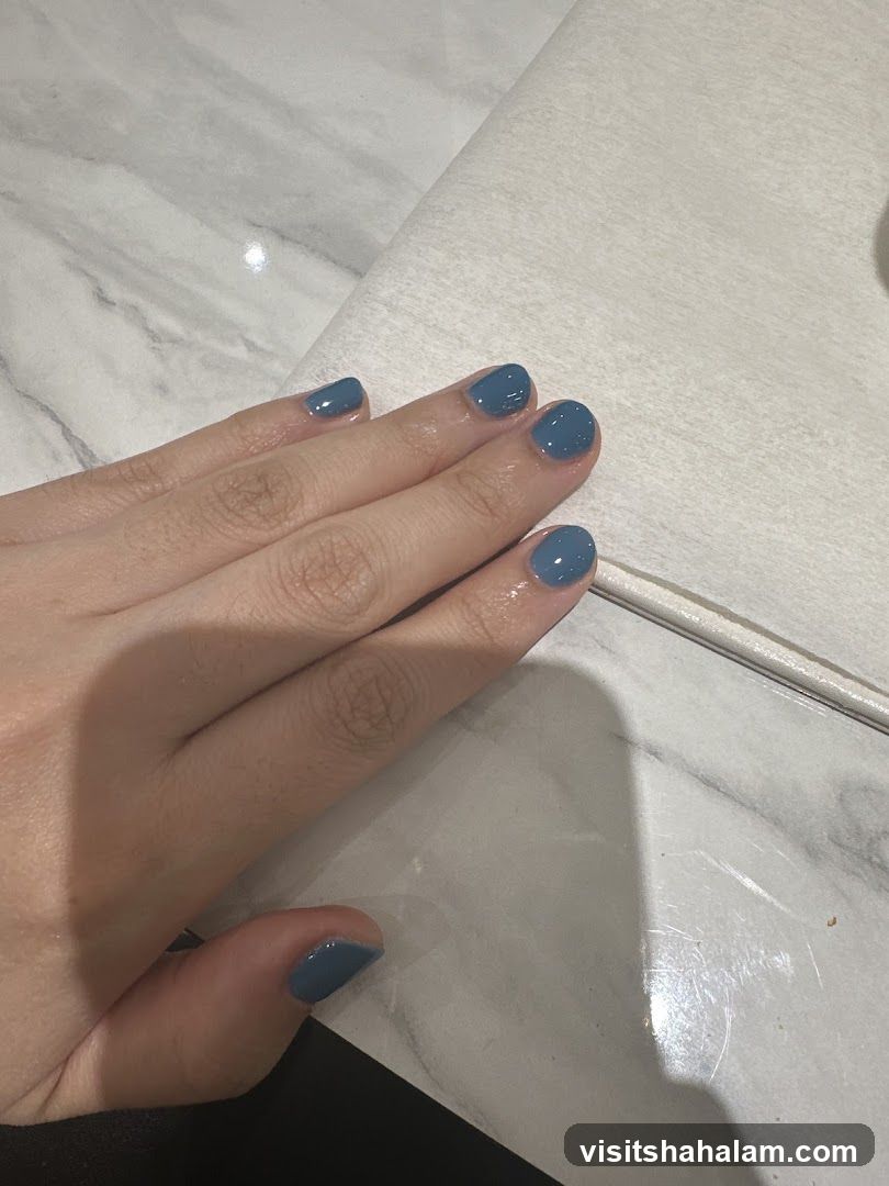 Hand with Blue Nails