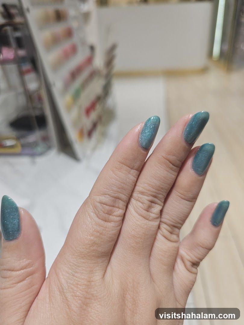 Hand with Teal Nail Polish