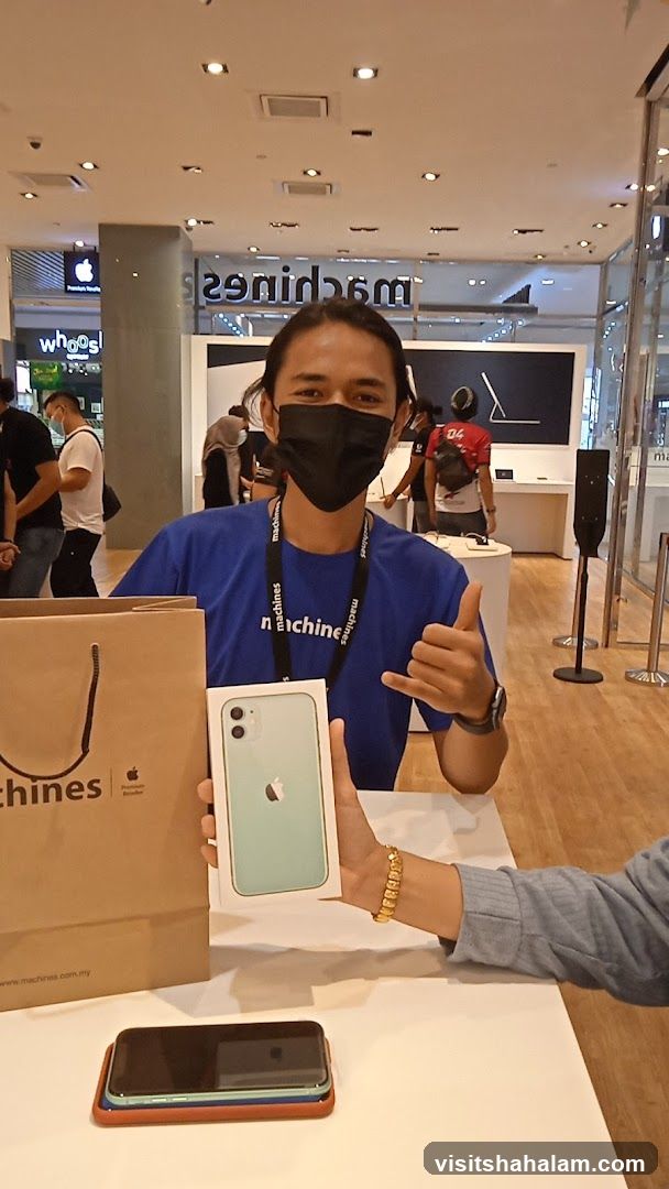 Salesperson holding an iPhone box
