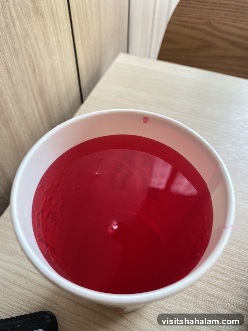 Red Drink in a White Cup