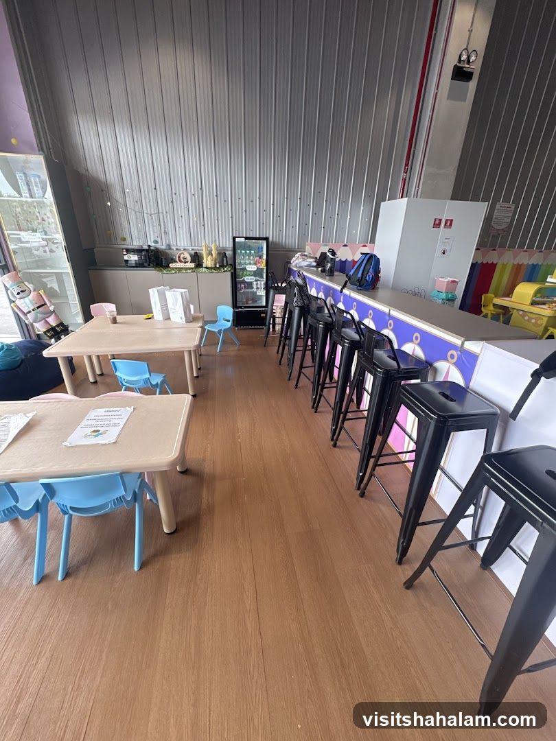 Indoor seating area with tables and bar stools