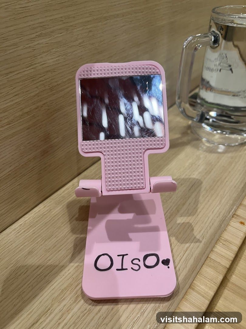 Pink phone stand with text