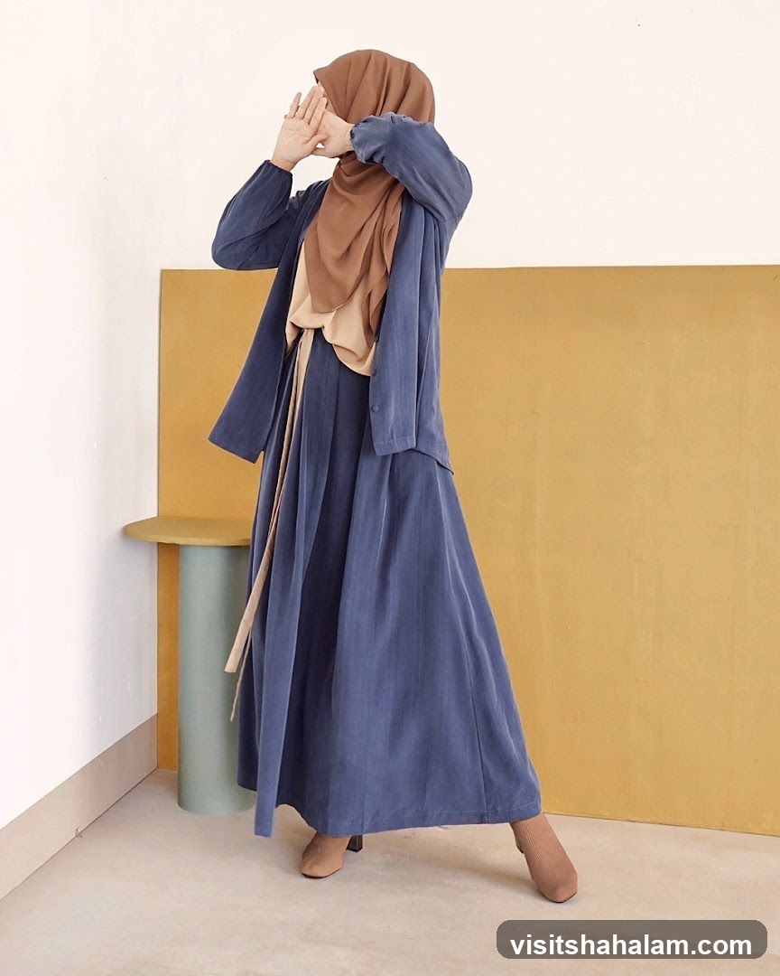Woman in Blue Dress and Hijab