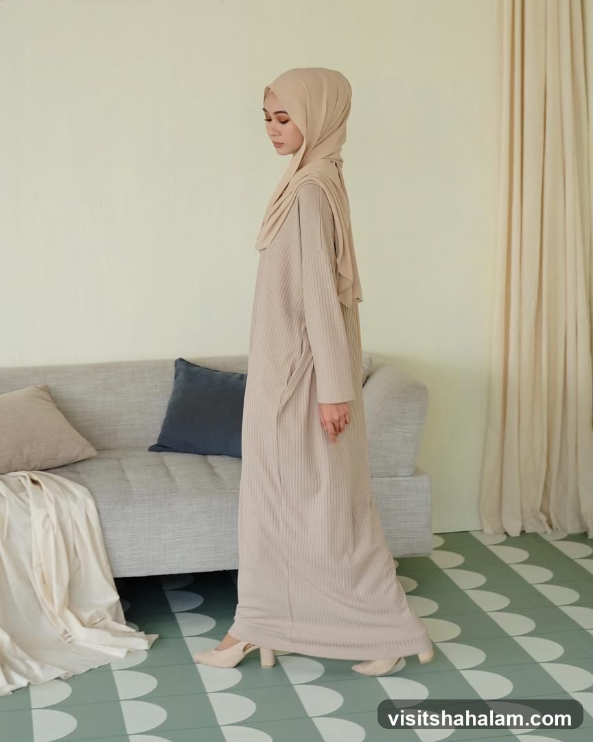 Woman in a beige dress and hijab
