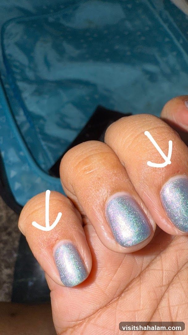 Fingers with iridescent nail polish