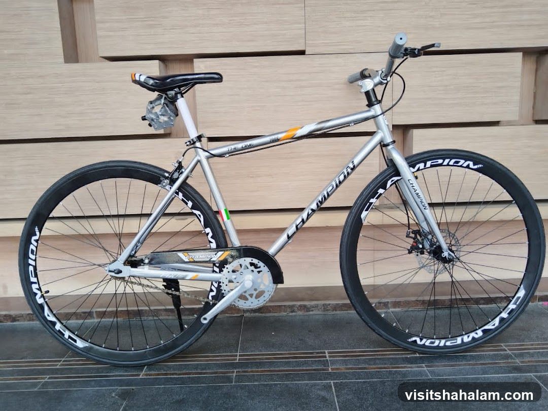 Silver bicycle with "CHAMPION" branding