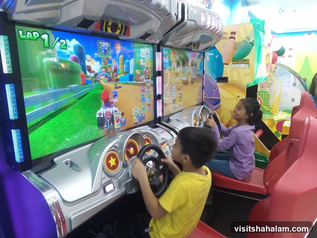Children Playing Arcade Racing Game